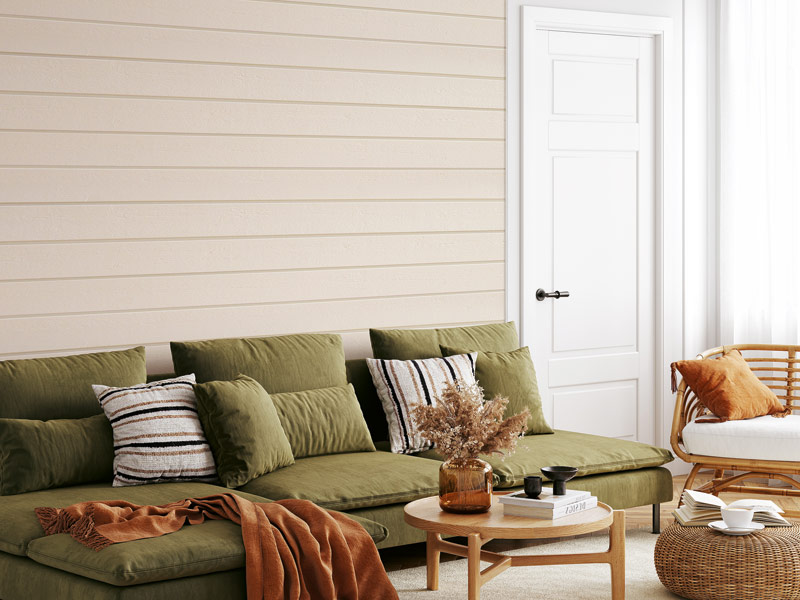 Moderne Wandgestaltung mit Holzfarbe im Wohnbereich mit einem grünem Sofa