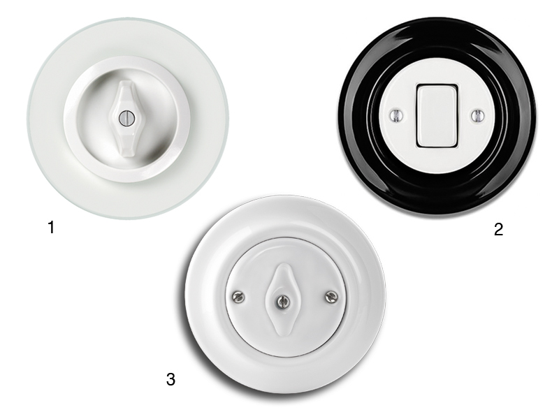3 runde Schalter in unterschiedlichem Design aber alle in Weiß und Schwarz
