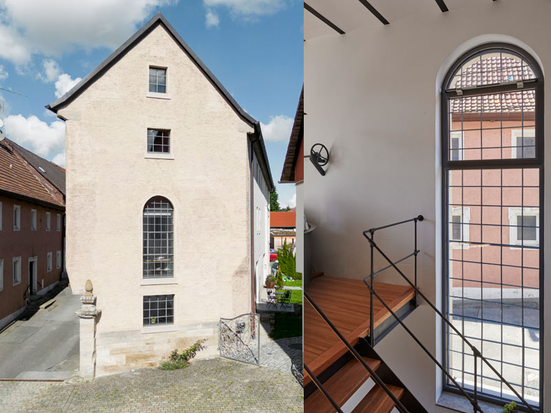 Denkmalgeschütztes Haus mit erneuten Fenstern, im Detail das Rundbogenfenster.